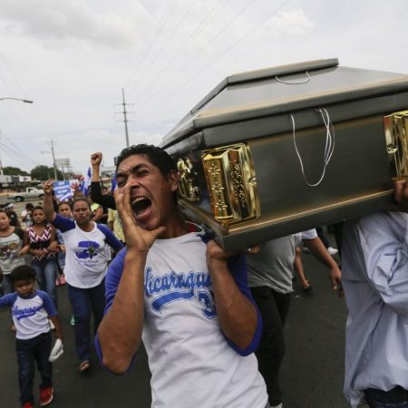 Friends and relatives carry the coffin containing the body of the student Gerald Velazquez, shot dead during clashes with riot police in a church near the National Autonomous University of Nicaragua (UNAN) in Managua,on July 16, 2018.Government forces in Nicaragua on Saturday shot dead two young men at a protest site in a church, the clergy said, on the third day of nationwide demonstrations against President Daniel Ortega, a former revolutionary hero now accused of authoritarianism. / AFP PHOTO / INTI OCON / The erroneous mention[s] appearing in the metadata of this photo by INTI OCON has been modified in AFP systems in the following manner: [Velazquez] instead of [Vazquez]. Please immediately remove the erroneous mention[s] from all your online services and delete it (them) from your servers. If you have been authorized by AFP to distribute it (them) to third parties, please ensure that the same actions are carried out by them. Failure to promptly comply with these instructions will entail liability on your part for any continued or post notification usage. Therefore we thank you very much for all your attention and prompt action. We are sorry for the inconvenience this notification may cause and remain at your disposal for any further information you may require.