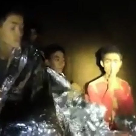 This handout video grab taken from footage released by the Royal Thai Navy on July 4, 2018 and taken on July 3 shows Adul Sam-on (R), a member of a Thai youth football team who is trapped with 11 other children and their coach, gesturing as he sits inside the Tham Luang cave in Khun Nam Nang Non Forest Park in Mae Sai district, Chiang Rai province.Born in Myanmar, raised by Christian teachers in Thailand, and trapped in a flooded cave for 13 days, Adul Sam-on is a stateless boy being praised for his unflinching politeness, English skills and composure throughout his underground ordeal. Images of the wide-eyed teen were beamed around the world when he was discovered alive with his young football team and their coach nine days after they went missing in the waterlogged Tham Luang cave in northern Thailand. / AFP PHOTO / ROYAL THAI NAVY / Handout / -----EDITORS NOTE --- RESTRICTED TO EDITORIAL USE - MANDATORY CREDIT "AFP PHOTO / ROYAL THAI NAVY" - NO MARKETING - NO ADVERTISING CAMPAIGNS - DISTRIBUTED AS A SERVICE TO CLIENTS / “The erroneous mention[s] appearing in the metadata of this photo by Handout has been modified in AFP systems in the following manner: [R] instead of [L]. Please immediately remove the erroneous mention[s] from all your online services and delete it (them) from your servers. If you have been authorized by AFP to distribute it (them) to third parties, please ensure that the same actions are carried out by them. Failure to promptly comply with these instructions will entail liability on your part for any continued or post notification usage. Therefore we thank you very much for all your attention and prompt action. We are sorry for the inconvenience this notification may cause and remain at your disposal for any further information you may require.”