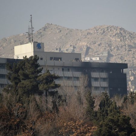 Afghan security personnel are seen on the rooftop of the Intercontinental Hotel after an attack in Kabul on January 21, 2018.
Gunmen stormed a luxury hotel in Kabul and killed at least six people including a foreigner, sparking a 12-hour battle that left terrified guests scrambling to escape and parts of the building ablaze. The Taliban claimed responsibility for the attack on the six-storey Intercontinental Hotel on a hilltop overlooking the Afghan capital. People trapped at the top of the building tied bedsheets together and climbed over balconies to escape the overnight assault. / AFP PHOTO / WAKIL KOHSAR